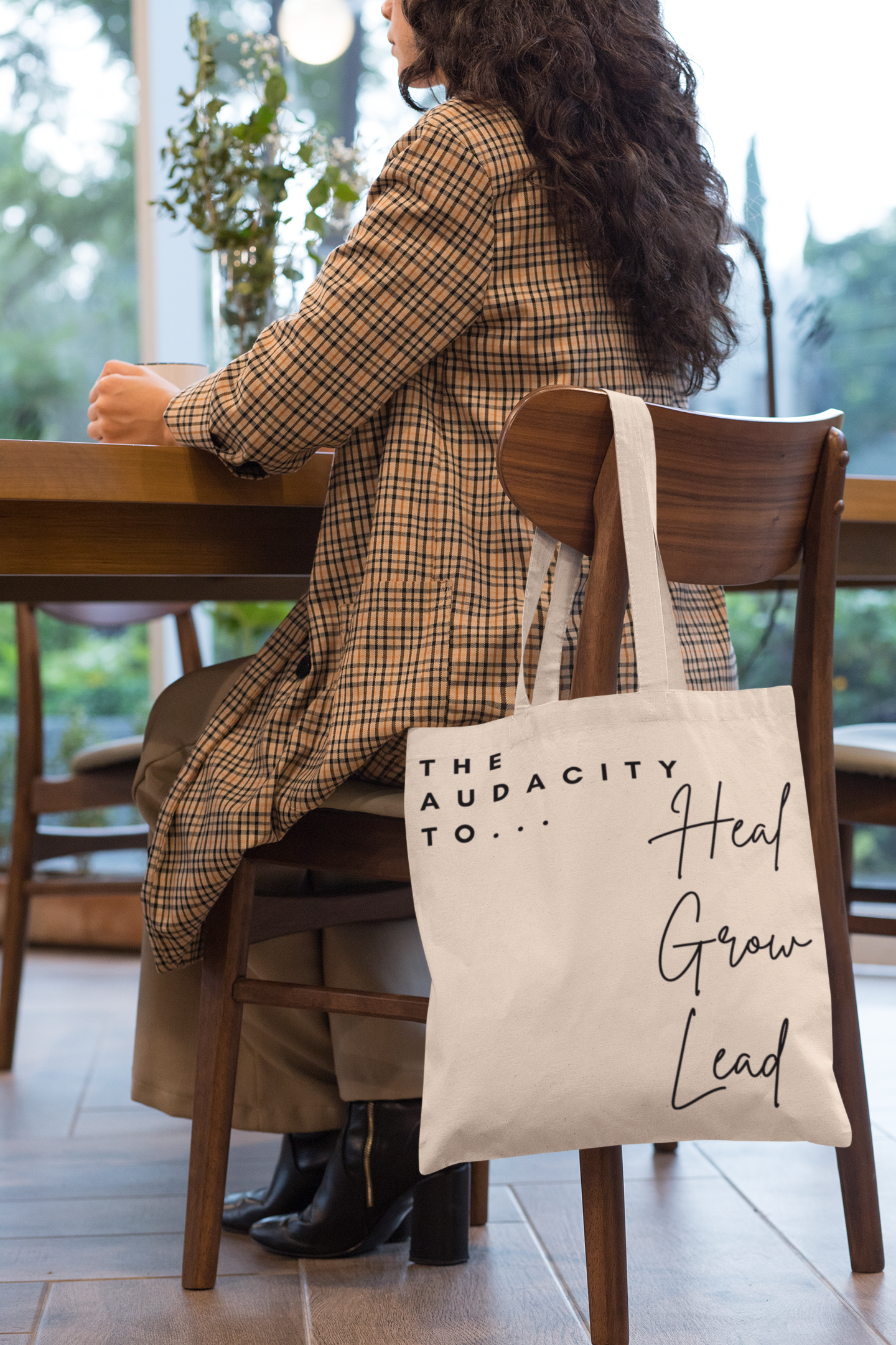 tote-bag-mockup-of-a-woman-sitting-on-a-chair-29457